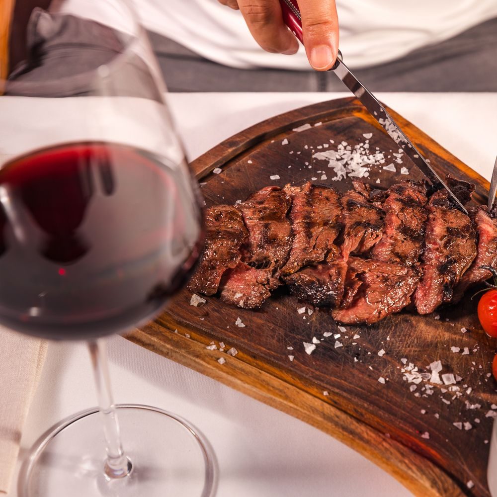 Red wine and Wagyu striploin on the board