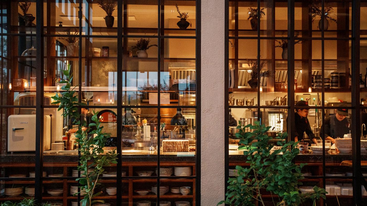 The open kitchen of ETNA behind glass