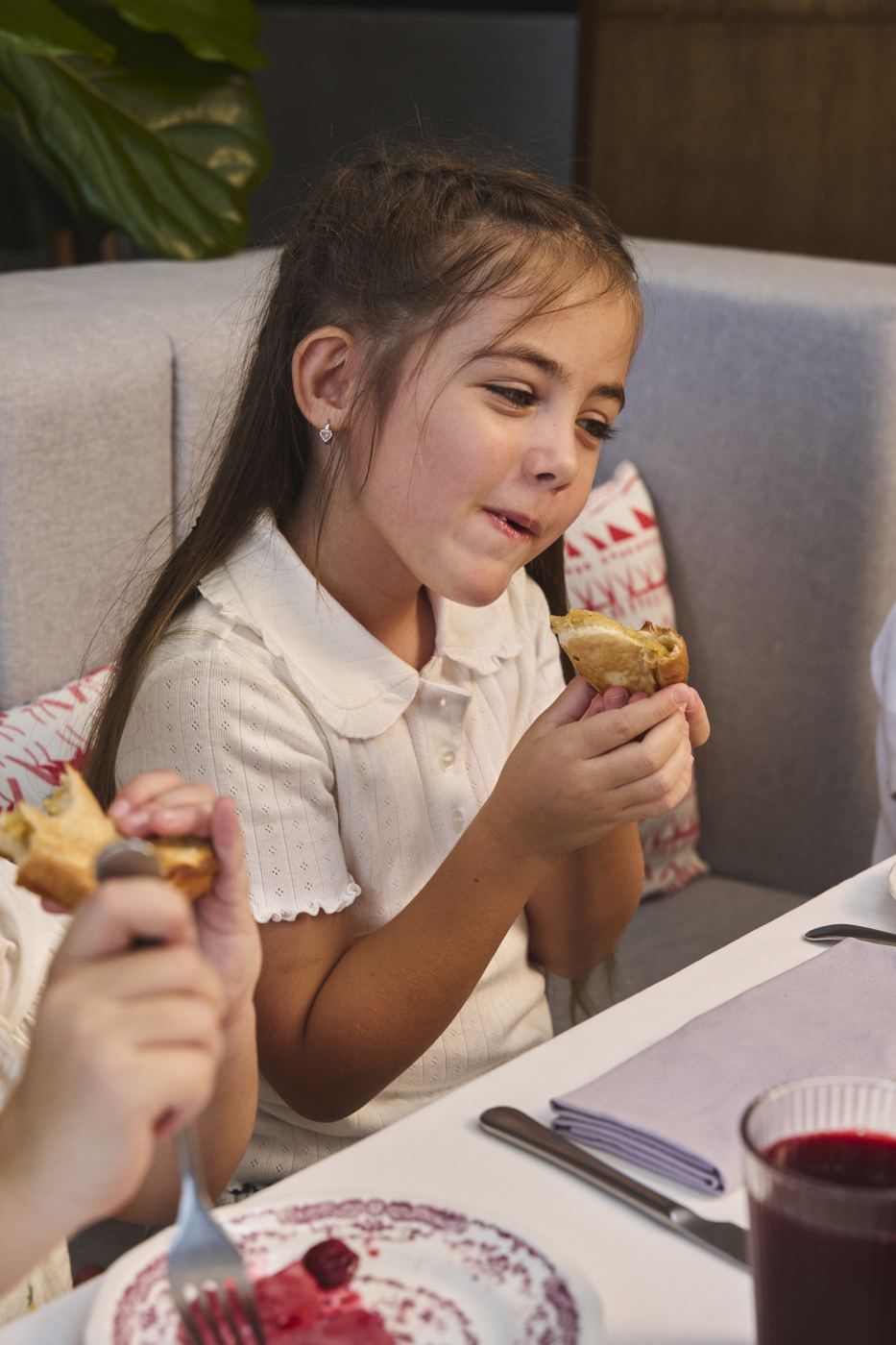 A girl enjoying a pastry at ETNA