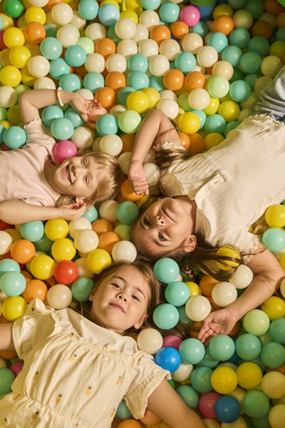 Kids laughing in the ball pit
