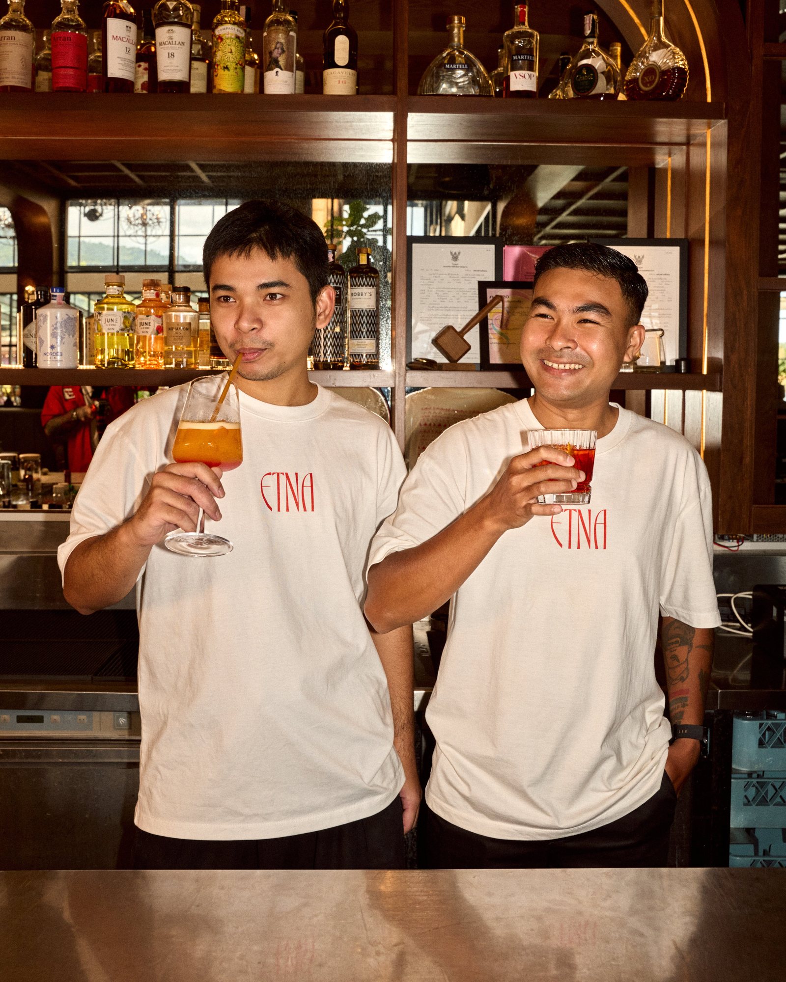 Two ETNA bartenders with Negronis